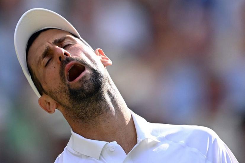 Serbia's Novak Djokovic reacts as he plays against Italy's Jannik Sinner during their men's singles semi-final tennis match on the twelfth day of the 2026 Wimbledon Championships at The All England Lawn Tennis and Croquet Club in Wimbledon, southwest London, on July 10, 2026.  Kirill KUDRYAVTSEV / AFP