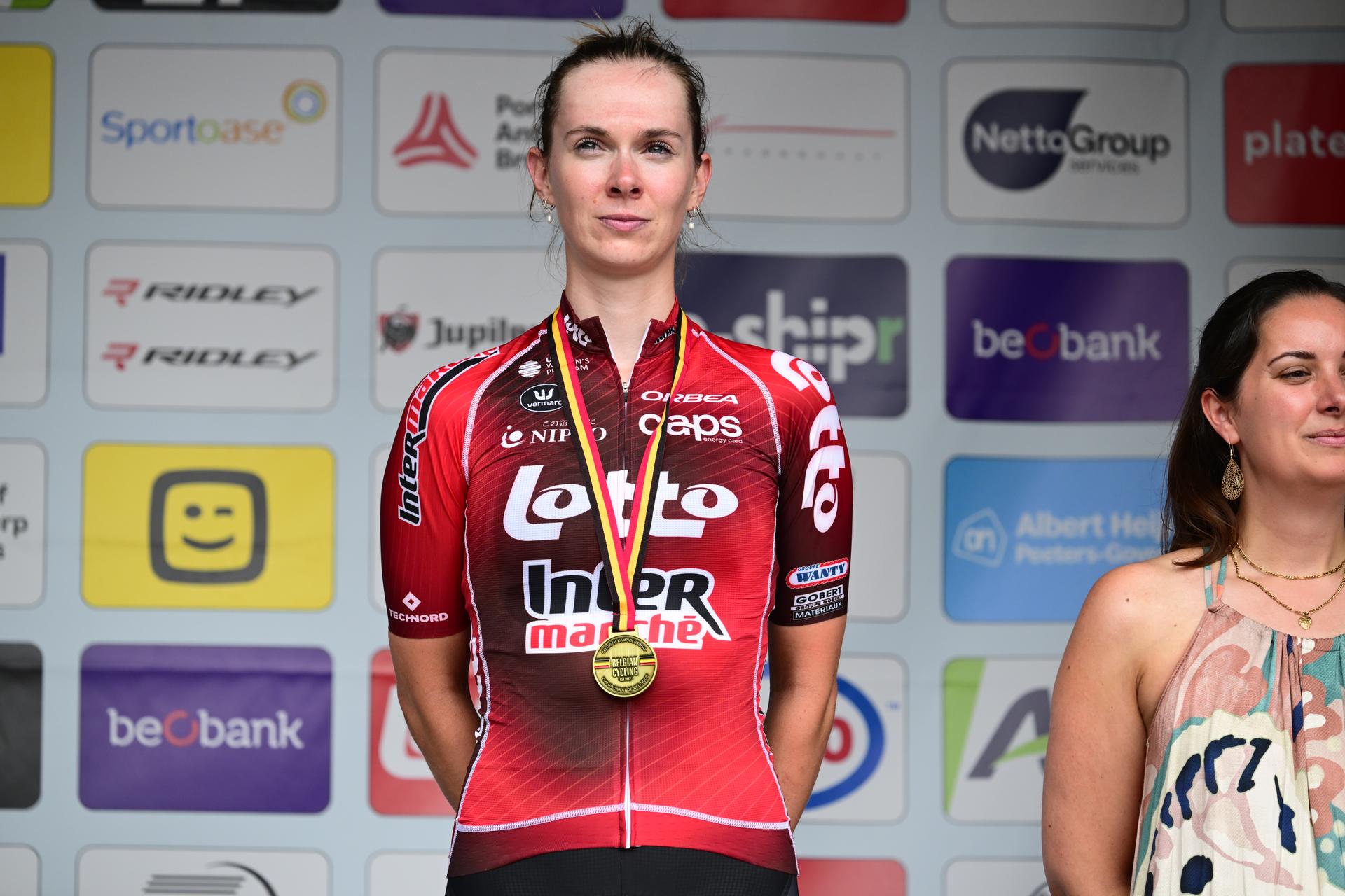 Belgian Shari Bossuyt celebrates on the podium with the gold medal after winning the women's elite race (137km) at the Belgian Cycling Championships, in Brasschaat, on Sunday 28 June 2026. BELGA PHOTO TOM GOYVAERTS