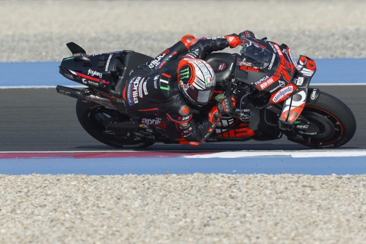 Aprilia Racing's Italian rider Marco Bezzecchi drives during the second free practice session of the Qatar MotoGP Grand Prix at the Lusail International Circuit in Lusail, north of Doha, on April 12, 2025.   Karim JAAFAR / AFP