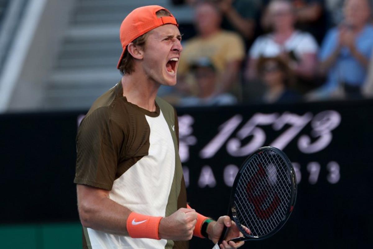USA's Sebastian Korda celebrates winning the second set against compatriot Michael Zheng during their men's singles match on day one of the Australian Open in Melbourne on January 18, 2026.  IZHAR KHAN / AFP