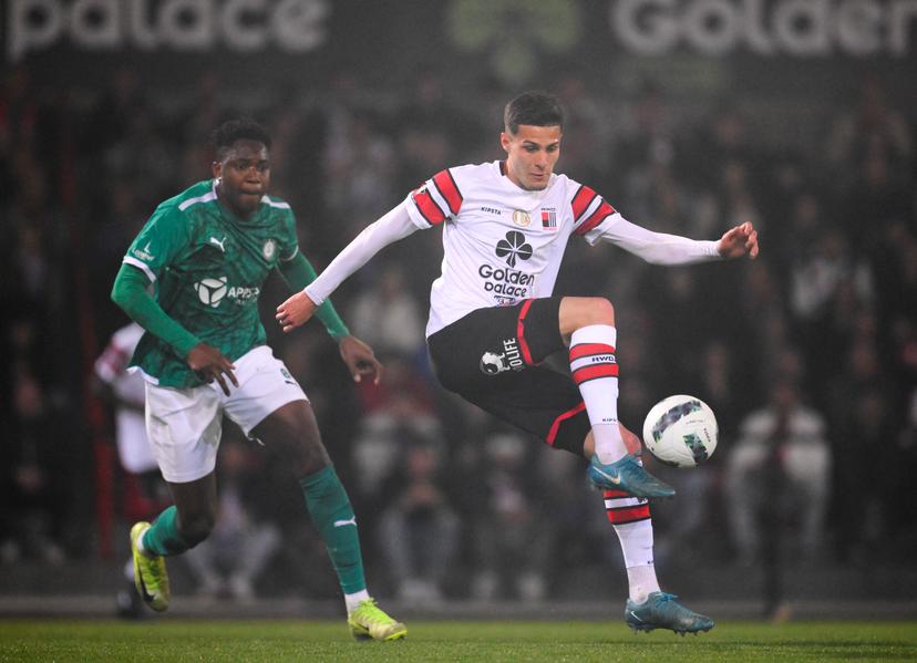 Lommel's Ibrahima Kebe and Rwdm's Romildo Del Piage fight for the ball during a soccer match between RWD Molenbeek and Lommel SK, Friday 11 April 2025 in Brussels, on day 29 of the 2024-2025 'Challenger Pro League' 1B second division of the Belgian championship. BELGA PHOTO JOHN THYS
