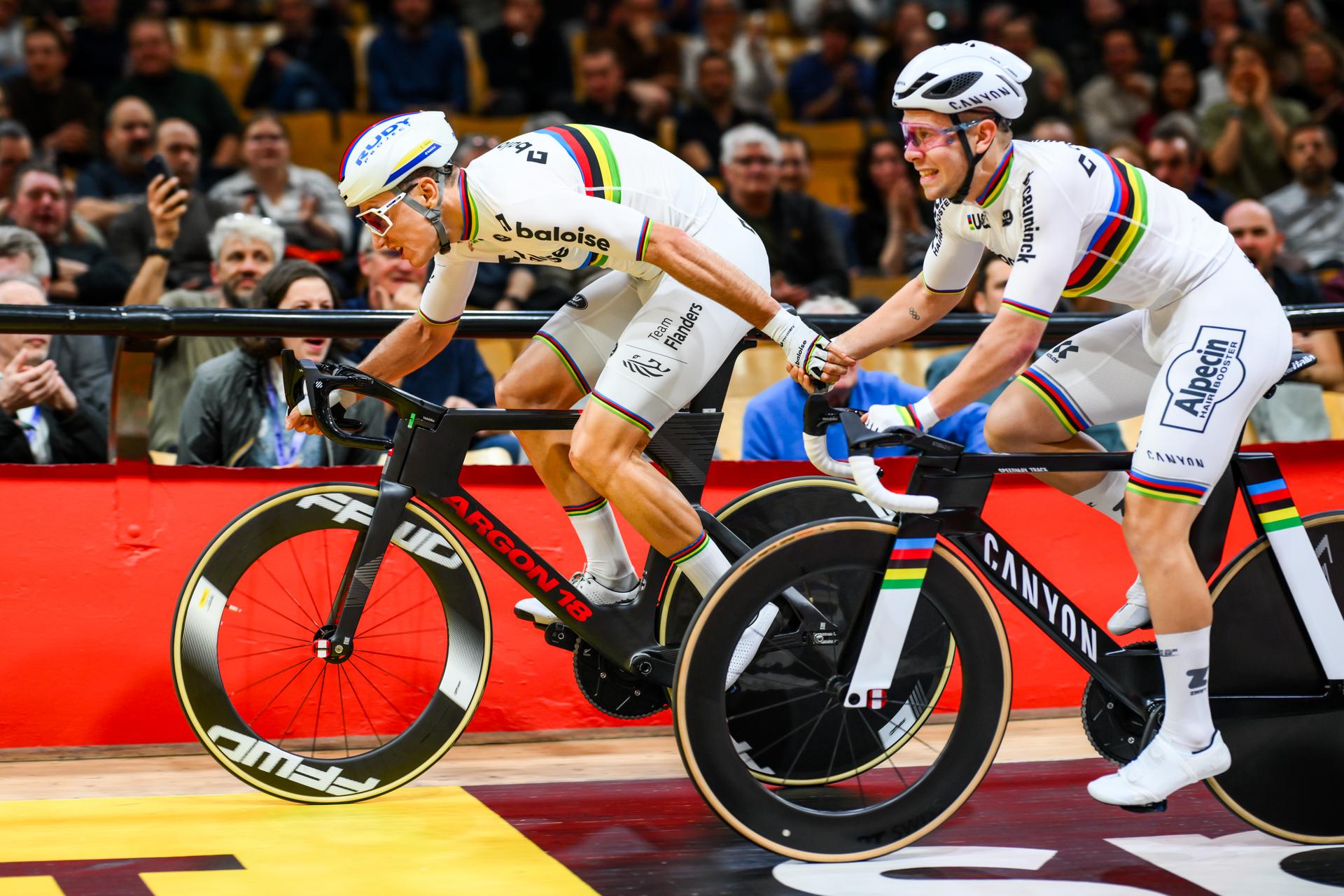 Belgian Lindsay De Vylder and Belgian Fabio Van Den Bossche pictured in action during the first day of the Zesdaagse Vlaanderen-Gent six-day indoor track cycling event at the indoor cycling arena 't Kuipke, Tuesday 18 November 2025, in Gent. BELGA PHOTO DAVID PINTENS