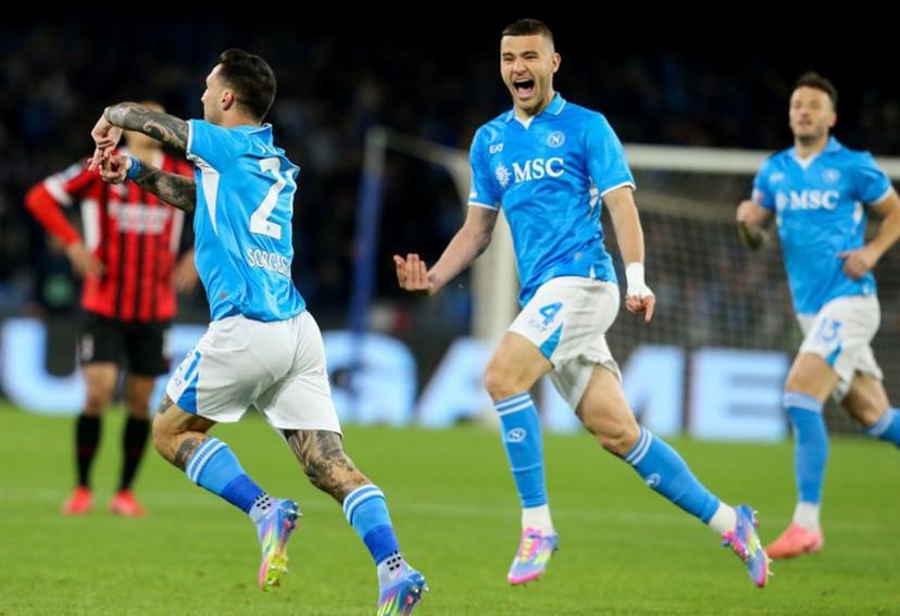 Napoli's Italian forward #21 Matteo Politano (L) celebrates after scoring a goal with teammate Napoli's Italian defender #4 Alessandro Buongiorno (R) during the Italian Serie A football match between Napoli and AC Milan at the Stadio Diego Armando Maradona in Naples, on March 30, 2025.  CARLO HERMANN / AFP