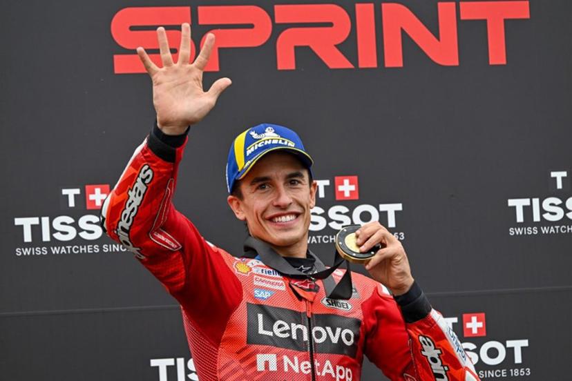Ducati Lenovo Team's Spanish rider Marc Marquez celebrates his victory with his gold medal after the sprint race ahead of the motorcycle Hungarian Moto GP Grand Prix at the Balaton Park circuit in Balatonfokajar, Hungary, on August 23, 2025.   ATTILA KISBENEDEK / AFP