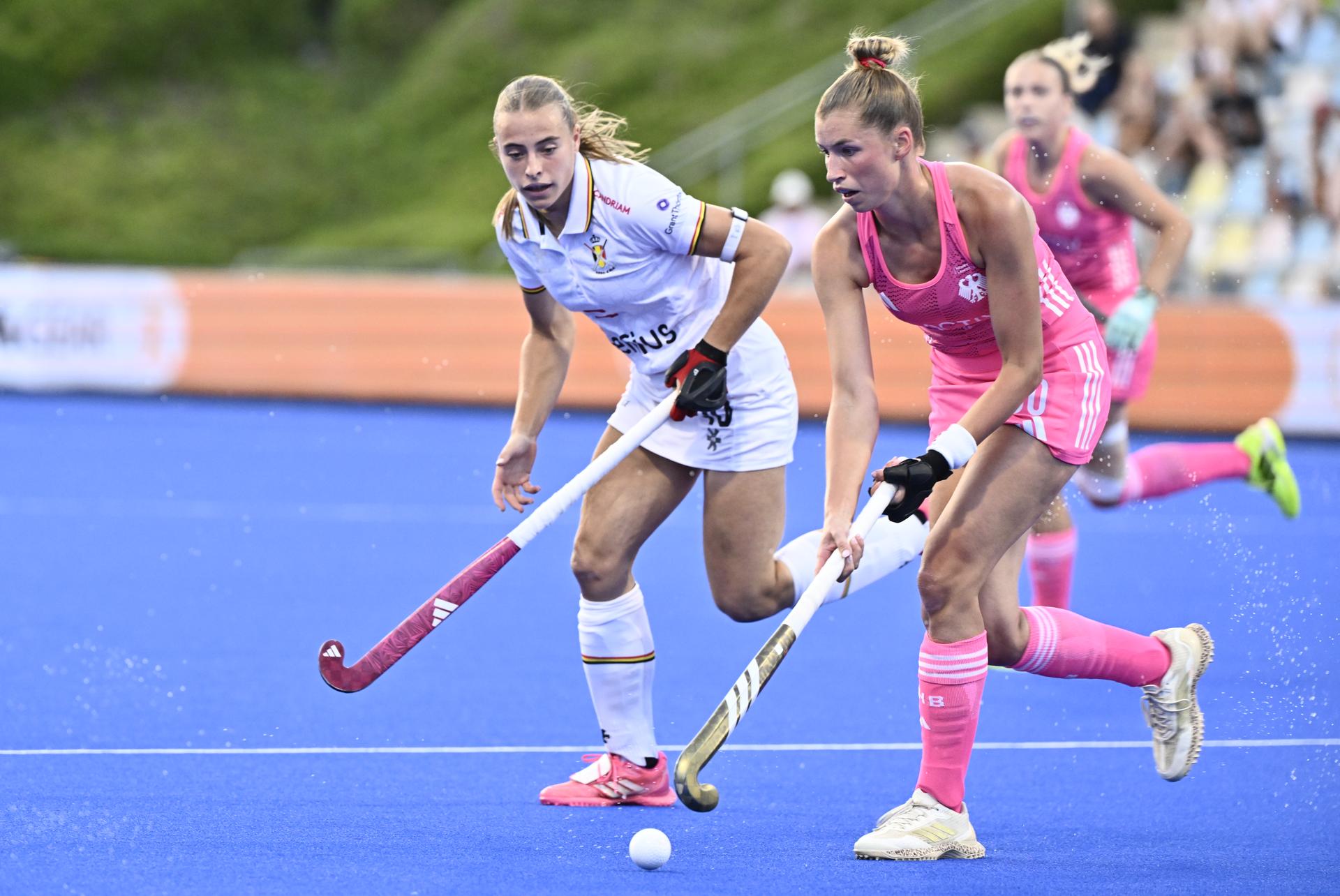 Belgium's Alix Gerniers and German player pictured in action during a hockey game between Germany and the Belgian national team Red Panthers, the semi-finals of the 2025 women's European championships, Friday 15 August 2025 in Monchengladbach, Germany.  BELGA PHOTO ERIC LALMAND