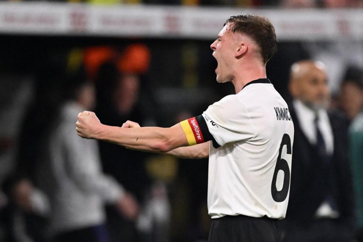 Germany's defender #06 Joshua Kimmich reacts after the final whistle of the UEFA Nations League quarter-final second leg football match Germany v Italy at the Signal Iduna Park stadium in Dortmund, western Germany on March 23, 2025.   Kirill KUDRYAVTSEV / AFP
