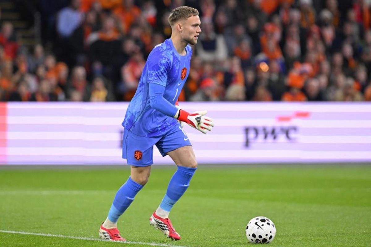 Netherlands' goalkeeper #01 Bart Verbruggen controls the ball during a friendly football match between the Netherlands and Norway at the Johan Cruijff Arena in Amsterdam on March 27, 2026.   JOHN THYS / AFP