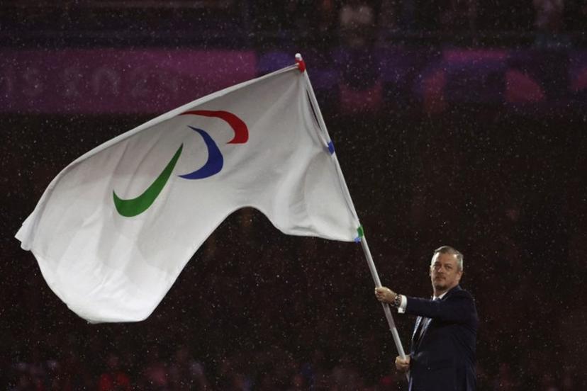 President of the International Paralympic Committee (IPC) Andrew Parsons waves the Paralympics flag during the Paris 2024 Paralympic Games Closing Ceremony at the Stade de France, in Saint-Denis, in the outskirts of Paris, on September 8, 2024.  Thibaud Moritz / AFP