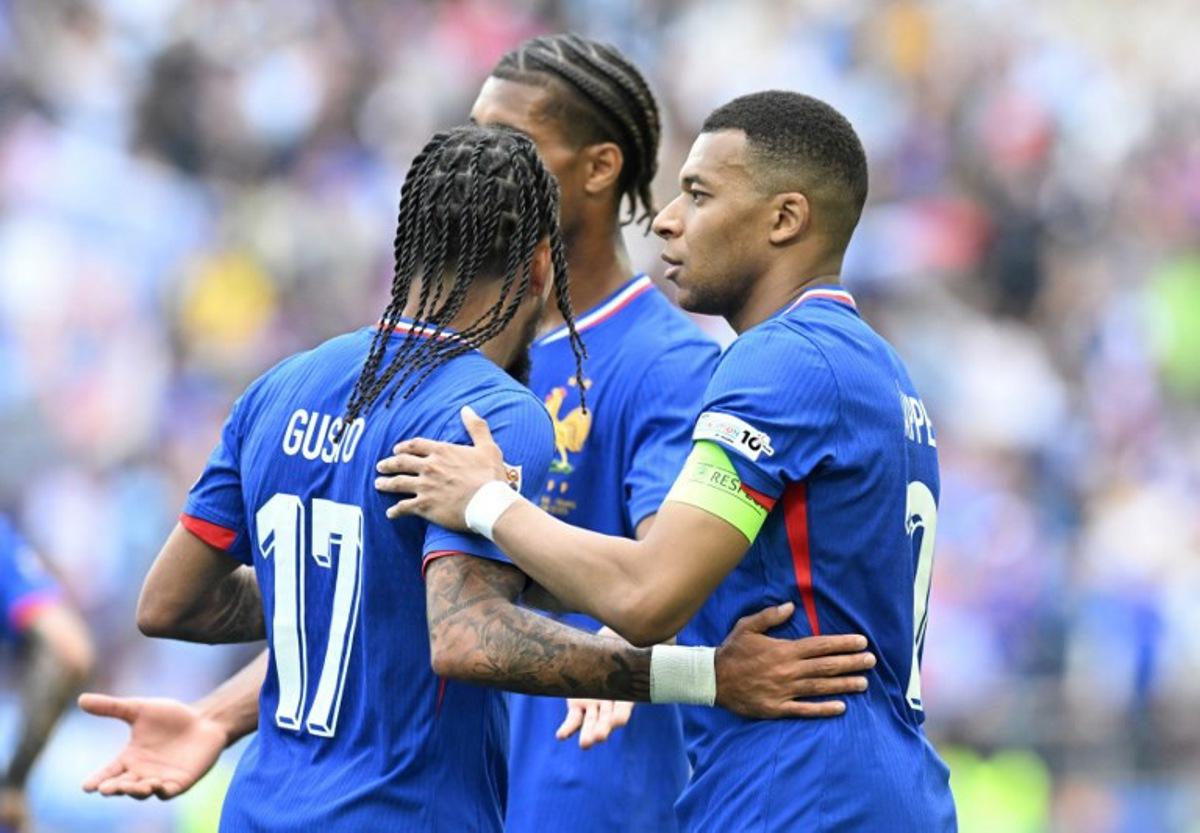 France's forward #10 Kylian Mbappe (R) celebrates scoring the opening goal with France's defender #17 Malo Gusto (L) and France's defender #04 Loic Bade during the UEFA Nations League third place play-off football match between Germany and France in Stuttgart, southwestern Germany on June 8, 2025.  THOMAS KIENZLE / AFP