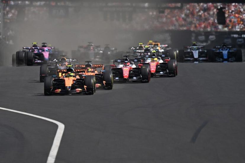 McLaren's British driver Lando Norris (C) followed by McLaren's Australian driver Oscar Piastri (C-R) and other cars compete during the Formula One Hungarian Grand Prix at the Hungaroring racetrack in Mogyorod near Budapest, Hungary, on July 26, 2026.  Attila KISBENEDEK / AFP