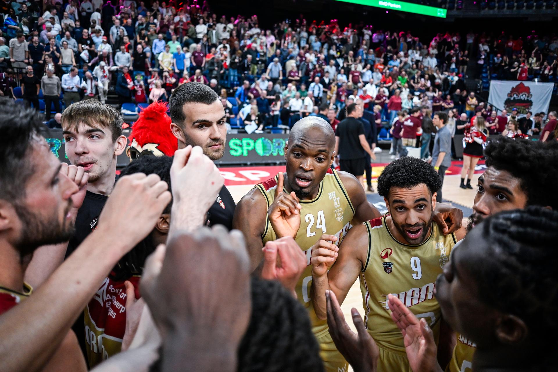 Antwerp's Kevin Tumba and Antwerp's Elias Lasisi celebrate after winning a basketball match between Antwerp Giants and BC Oostende, Thursday 15 May 2025 in Antwerp, a quarter final game (2nd leg, best-of-3) in the playoffs of the 'BNXT League' Belgian/ Dutch first division basket championship. BELGA PHOTO TOM GOYVAERTS
