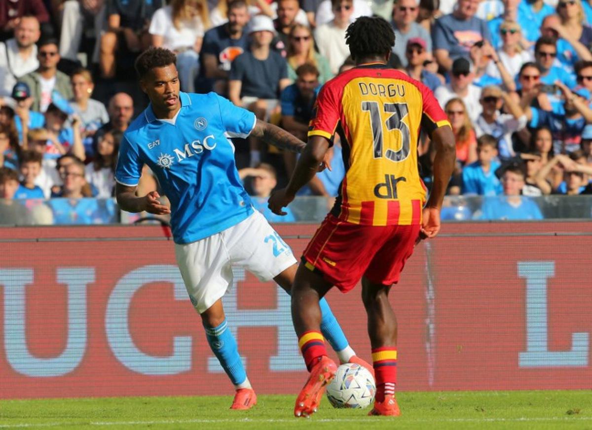 Napoli's Belgian forward #26 Cyril Ngonge fights for the ball with Lecce's Danish defender #13 Patrick Dorgu during the Italian Serie A football match between Napoli and Lecce at the Diego Armando Maradona stadium in Naples on October 26, 2024.  CARLO HERMANN / AFP