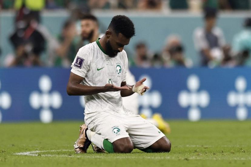 Saudi Arabia's forward #09 Firas Al-Buraikan kneels at the end of the Qatar 2022 World Cup Group C football match between Saudi Arabia and Mexico at the Lusail Stadium in Lusail, north of Doha on November 30, 2022.  Khaled DESOUKI / AFP