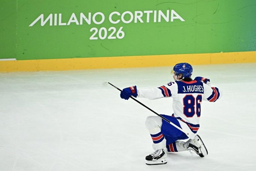 USA's #86 Jack Hughes celebrates scoring the 3-0 goal during the men's play-off semi-final ice hockey match between USA and Slovakia at the Milano Santagiulia Ice Hockey Arena during the Milano Cortina 2026 Winter Olympic Games in Milan, on February 20, 2026.  JULIEN DE ROSA / AFP