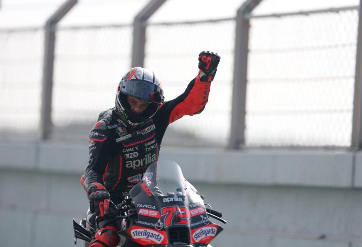 Aprilia Racing team's Italian MotoGP rider Marco Bezzecchi celebrates winning the MotoGP race of the Portuguese Grand Prix at the Algarve International Circuit in Portimao on November 9, 2025.  PATRICIA DE MELO MOREIRA / AFP