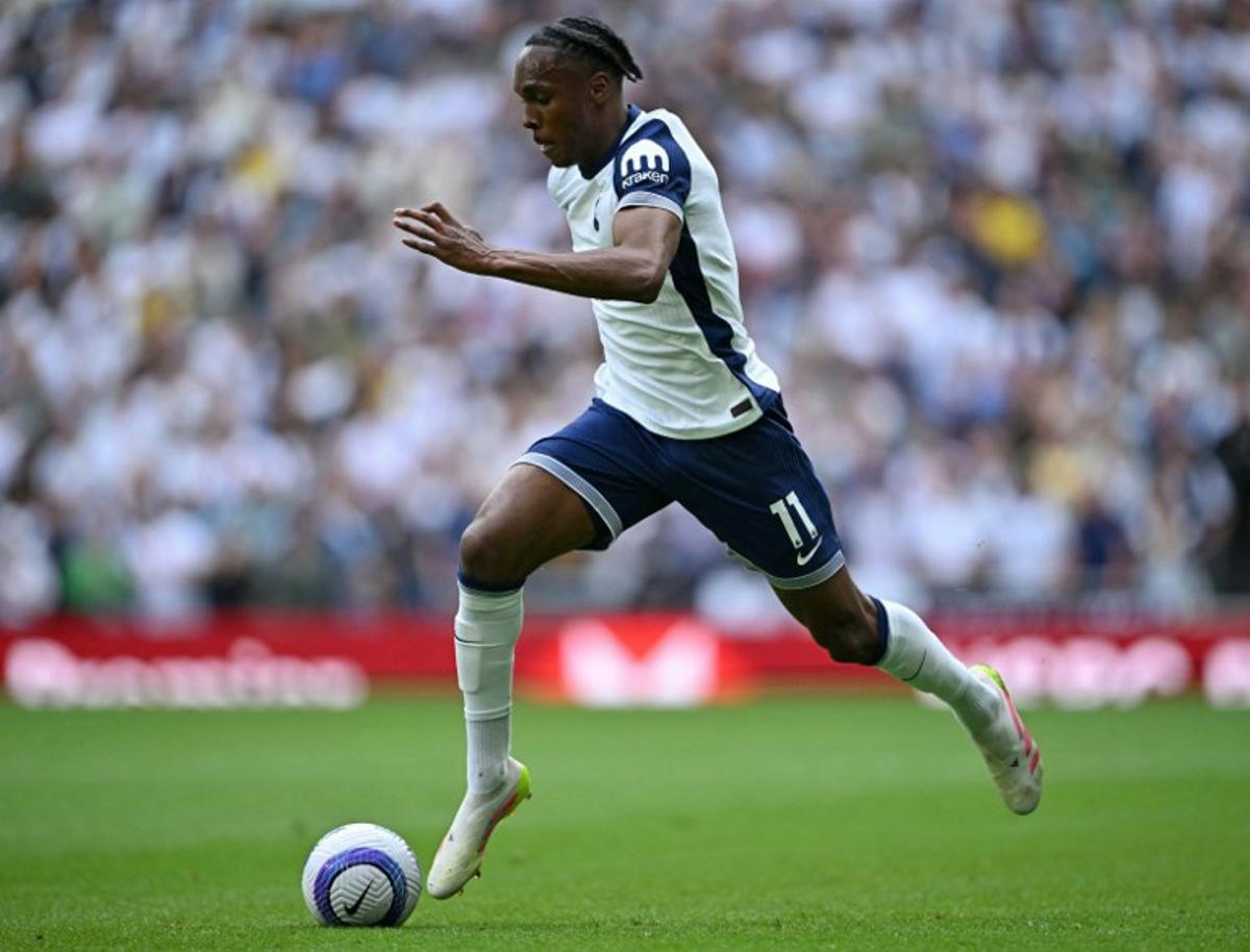 Tottenham Hotspur's French forward #11 Mathys Tel runs with the ball during the English Premier League football match between Tottenham Hotspur and Brighton and Hove Albion at the Tottenham Hotspur Stadium in London, on May 25, 2025.  JUSTIN TALLIS / AFP