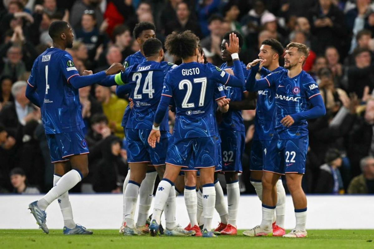 Chelsea's English midfielder #22 Kiernan Dewsbury-Hall (R) celebrates scoring his team's first goal with team mates during the UEFA Conference League semi-final second leg football match between Chelsea FC and Djurgardens IF at Stamford Bridge in London on May 8, 2025.  Glyn KIRK / AFP