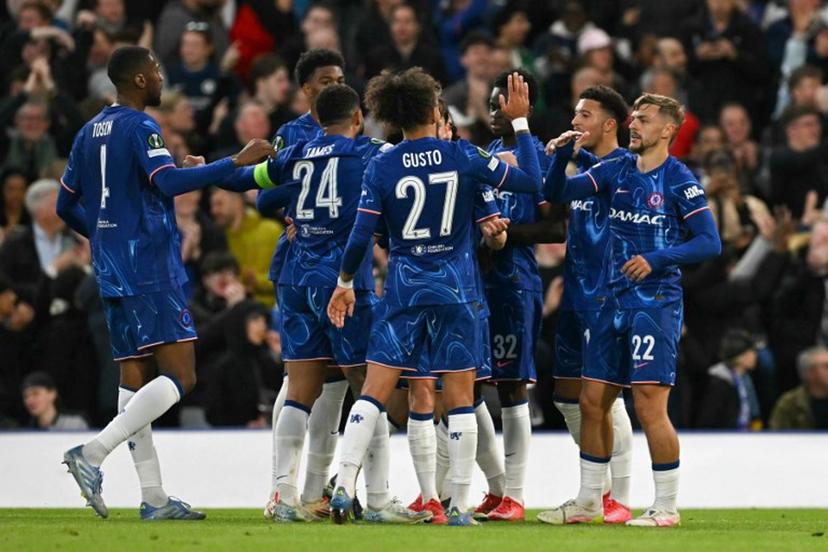 Chelsea's English midfielder #22 Kiernan Dewsbury-Hall (R) celebrates scoring his team's first goal with team mates during the UEFA Conference League semi-final second leg football match between Chelsea FC and Djurgardens IF at Stamford Bridge in London on May 8, 2025.  Glyn KIRK / AFP