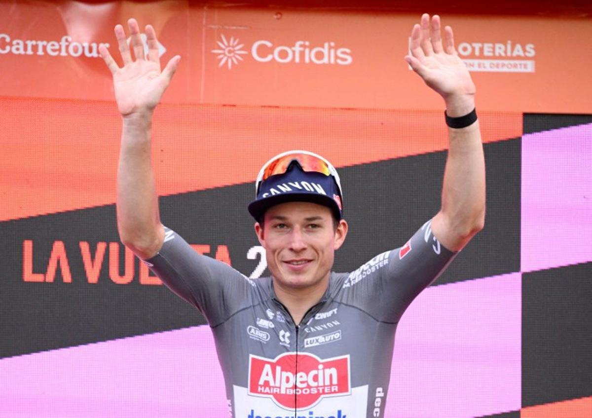 Team Alpecin's Belgian rider Jasper Philipsen celebrates on the podium after winning the eighth stage of the Vuelta a Espana, a 158 km race between Monzon Templario and Zaragoza, on August 30, 2025.    Josep LAGO / AFP