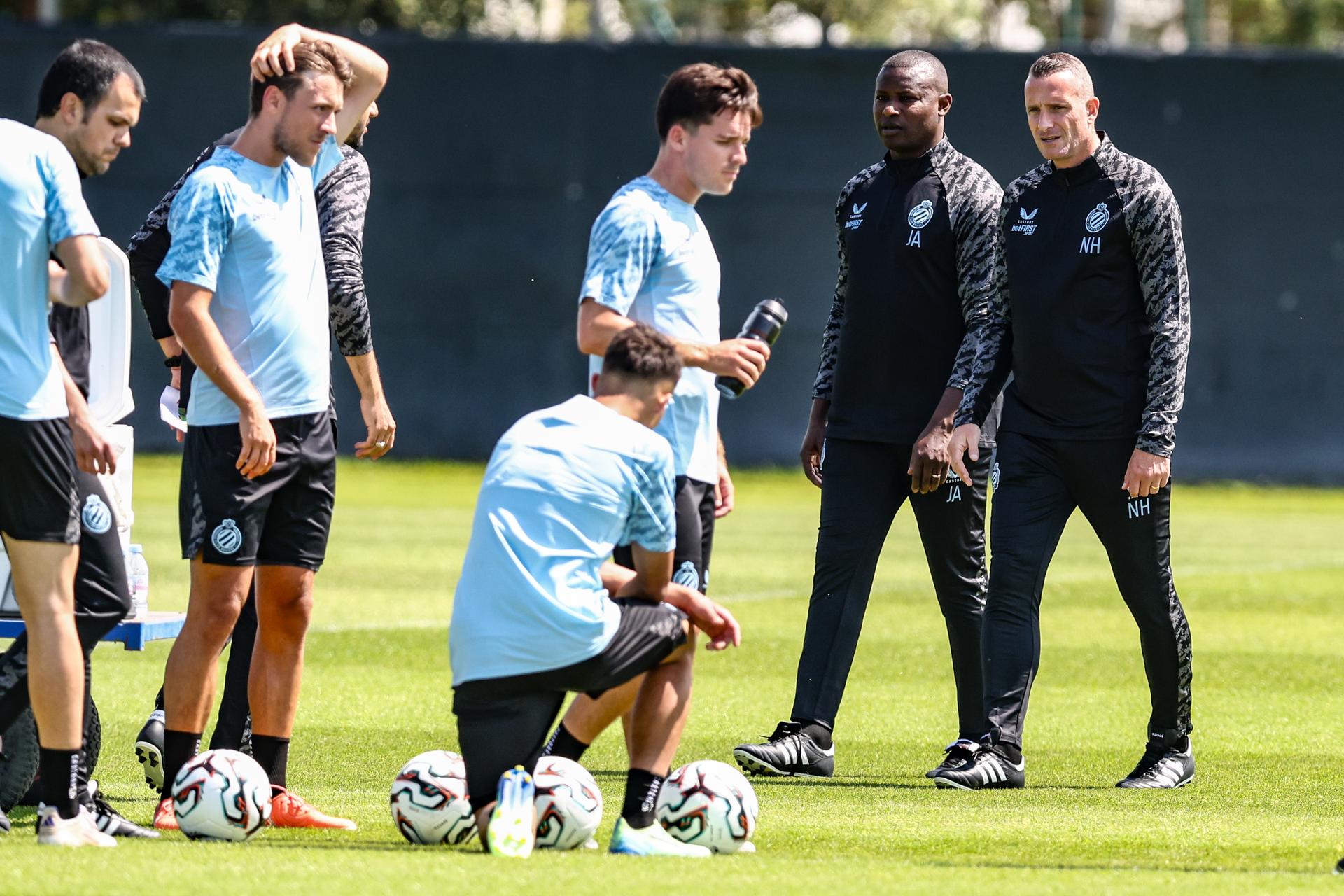 Club's assistant coach Joseph Akpala and Club's head coach Nicky Hayen pictured during a training session of Belgian soccer team Club Brugge KV, Monday 23 June 2025 in Knokke-Heist, in preparation of the upcoming 2025-2026 Belgian first division soccer season. BELGA PHOTO BRUNO FAHY