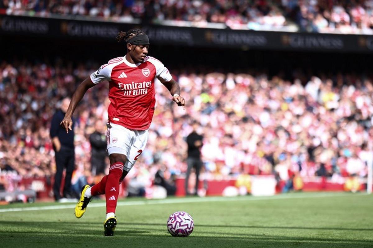 Arsenal's English defender #20 Noni Madueke runs with the ball during the English Premier League football match between Arsenal and Nottingham Forest at the Emirates Stadium in London on September 13, 2025.   HENRY NICHOLLS / AFP
