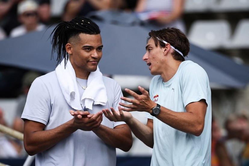 Greece's Emmanouil Karalis (L) and Sweden's Armand Duplantis speaks together prior to compete in the men's Pole Vault during the IAAF Diamond League athletics meeting, at the Charlety Stadium, in Paris on June 28, 2026.  Anne-Christine POUJOULAT / AFP
