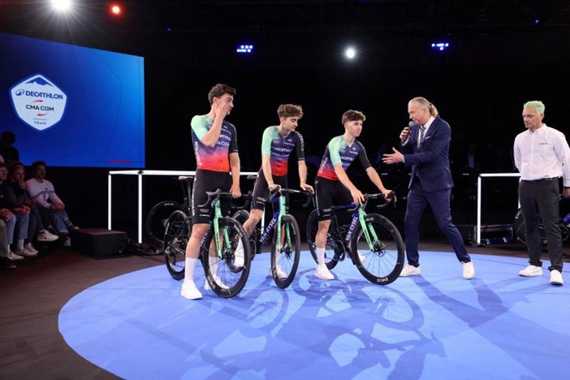 (From L) Decathlon-CMA CGM's Dutch cyclist Olav Kooij, French rider Paul Seixas and French rider Antoine L'Hote attend the presentation of the new Decathlon CMA-GGM cycling team at the Decathlon Campus in Villeneuve-d'Ascq, northern France on December 11, 2025.  Francois LO PRESTI / AFP
