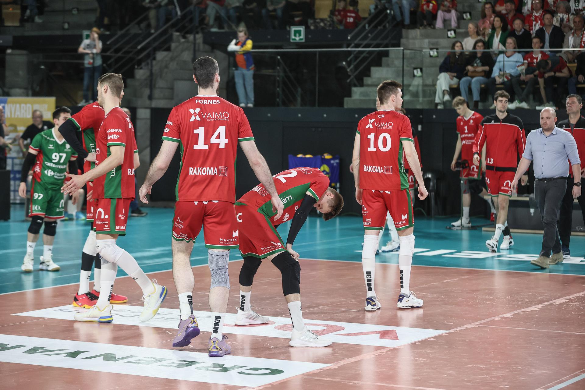 Maaseik's players look dejected after a volleyball match between Greenyard Maaseik and Knack Roeselare, Sunday 28 April 2024 in Maaseik, the last match of the best-of-five finals in the Play Offs of the Belgian volleyball competition. BELGA PHOTO BRUNO FAHY