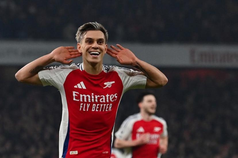 Arsenal's Belgian midfielder #19 Leandro Trossard celebrates after scoring his team second goal during the English Premier League football match between Arsenal and Tottenham Hotspur at the Emirates Stadium in London on January 15, 2025.   Glyn KIRK / AFP