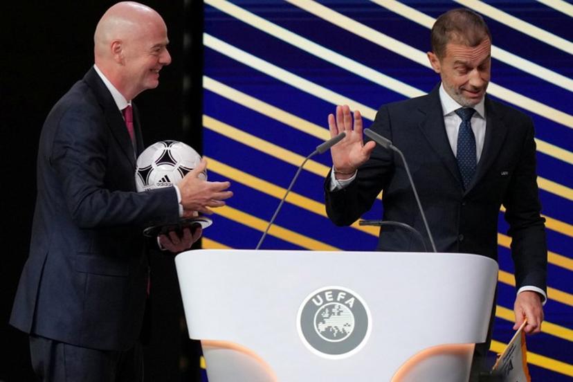 (FILES) FIFA President Gianni Infantino (L) speaks with UEFA president Aleksander Ceferin after addressing the 50th UEFA Ordinary Congress in Brussels on February 12, 2026. UEFA chief Aleksander Ceferin has ruled himself out of the running to replace Gianni Infantino, the under-fire FIFA president on August 24, 2026. Infantino has come under increasing pressure to step down over his now abandoned plan to secure private investment in FIFA tournaments, with Ceferin one of the leading figures in the challenge to him. Pau BARRENA / AFP
