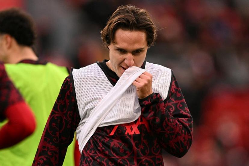 Liverpool's Italian striker #14 Federico Chiesa warm up ahead of the English Premier League football match between Liverpool and Wolverhampton Wanderers at Anfield in Liverpool, north west England on December 27, 2025.  Oli SCARFF / AFP
