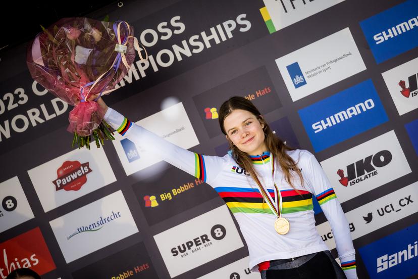 Canadian Isabella Holmgren celebrates on the podium after winning the Women Junior race at the UCI Cyclocross World Championships, in Hoogerheide, The Netherlands on Saturday 04 February 2023. BELGA PHOTO JASPER JACOBS
