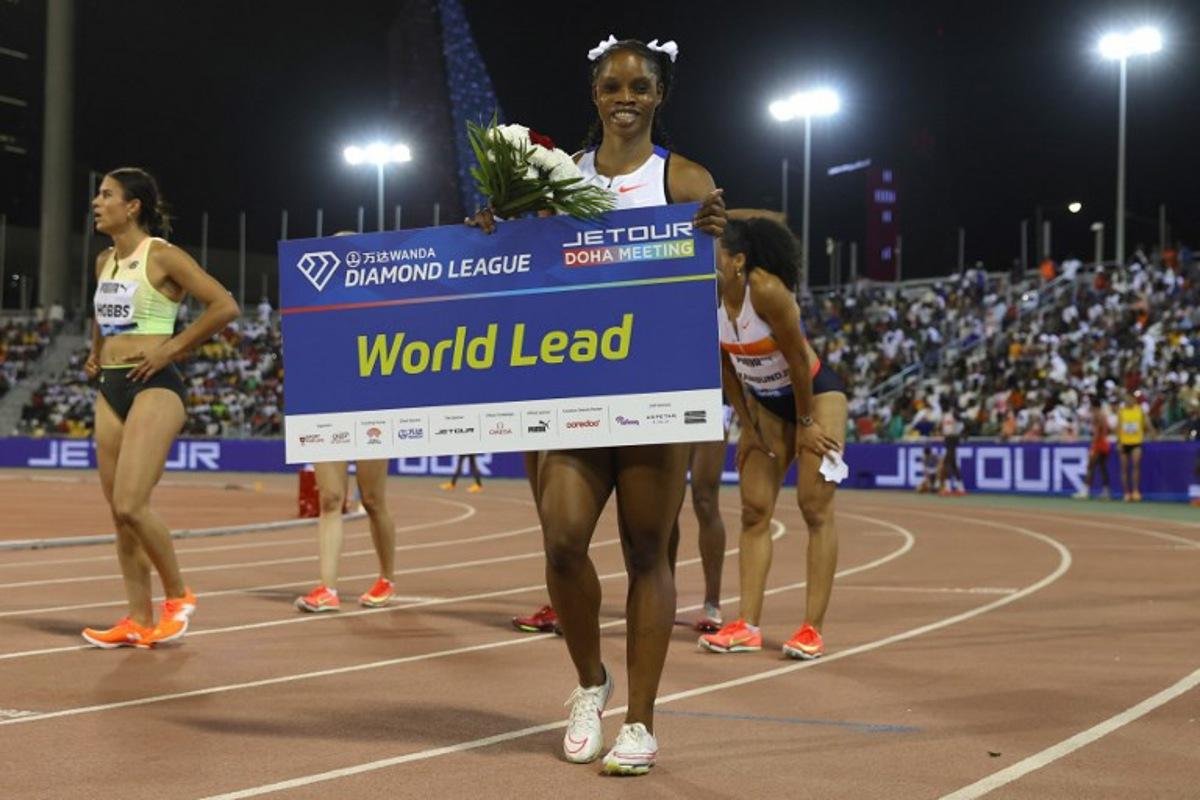 Jamaica's Tia Clayton celebrates after winning the women's 100m final during the IAAF Diamond League competition at the Suheim Bin Hamad Stadium in Doha on May 16, 2025.  Karim JAAFAR / AFP