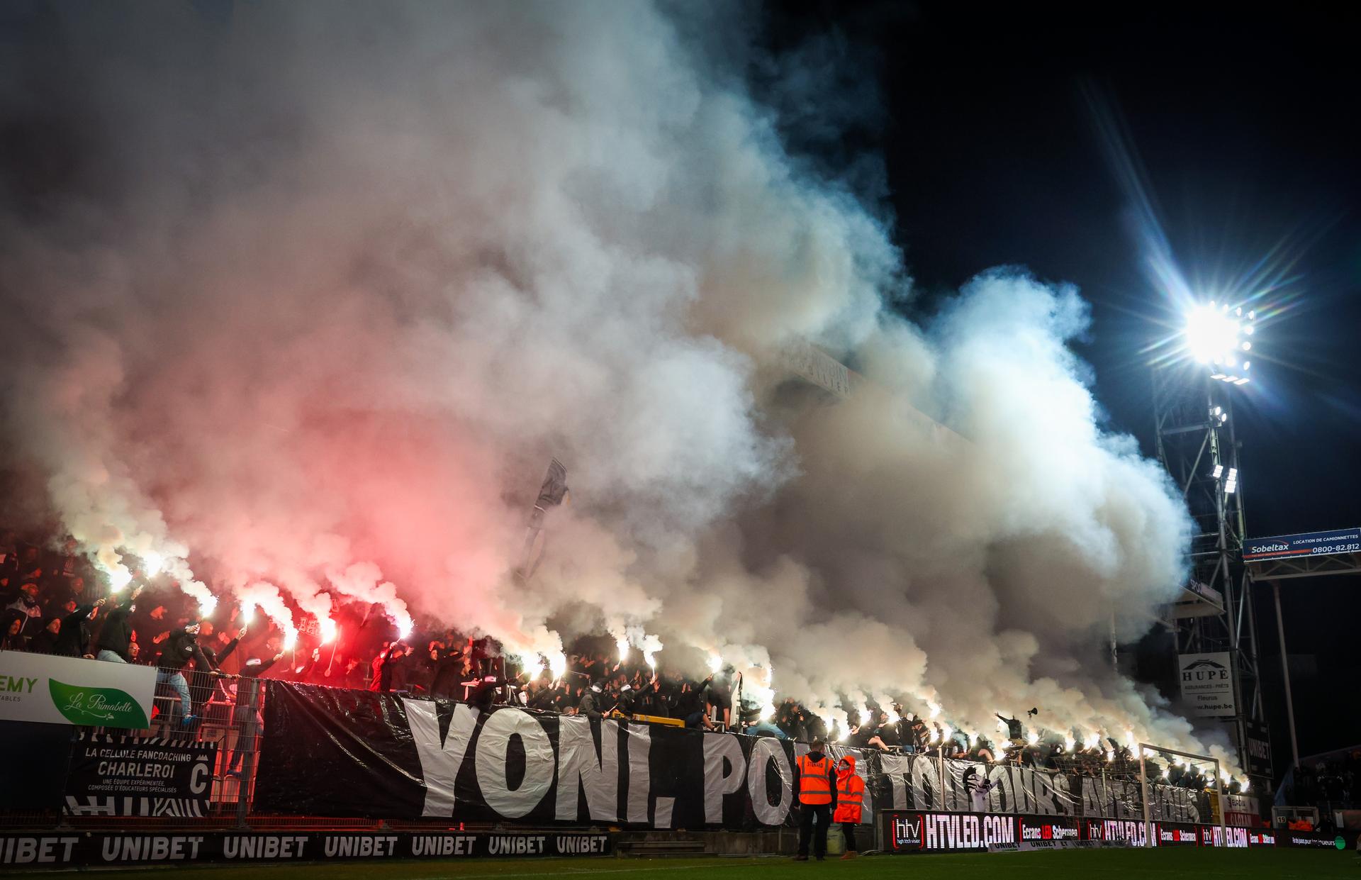 Charleroi's supporters with fireworks and smoke bombs pictured during a soccer match between Sporting Charleroi and Standard de Liege, Saturday 30 November 2024 in Charleroi, on day 16 of the 2024-2025 season of the 'Jupiler Pro League' first division of the Belgian championship. BELGA PHOTO VIRGINIE LEFOUR