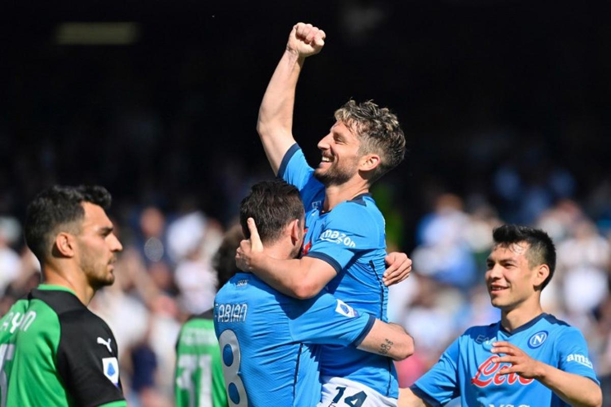 Napoli's Belgian forward Dries Mertens (up) celebrates his goal with teammates during the Italian Serie A football match Napoli vs Sassuolo at Diego Armando Maradona stadium in Naples, on April 30, 2022.  Alberto PIZZOLI / AFP