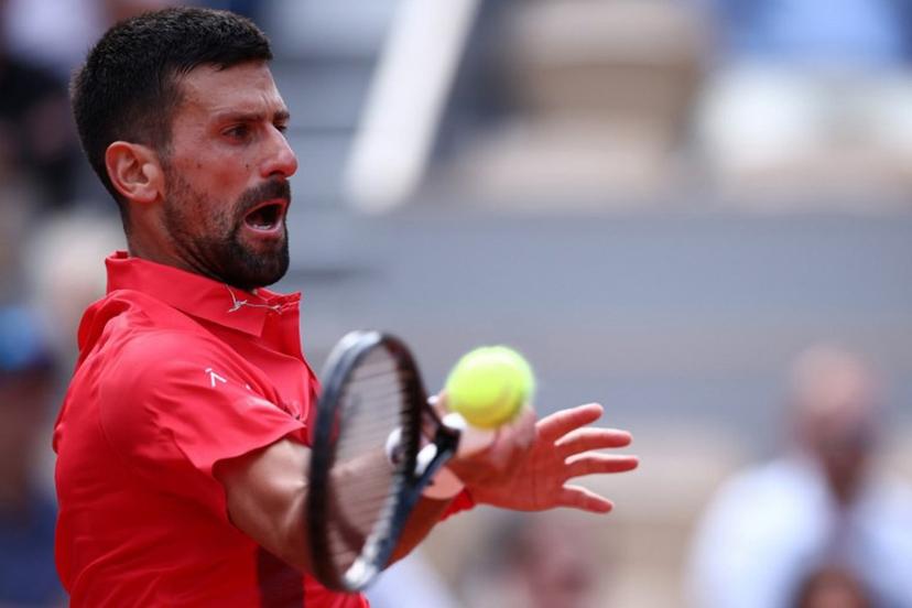 Serbia's Novak Djokovic plays a forehand return to Britain's Cameron Norrie during their men's singles match on day 9 of the French Open tennis tournament on Court Philippe-Chatrier at the Roland-Garros Complex in Paris on June 2, 2025.  Anne-Christine POUJOULAT / AFP