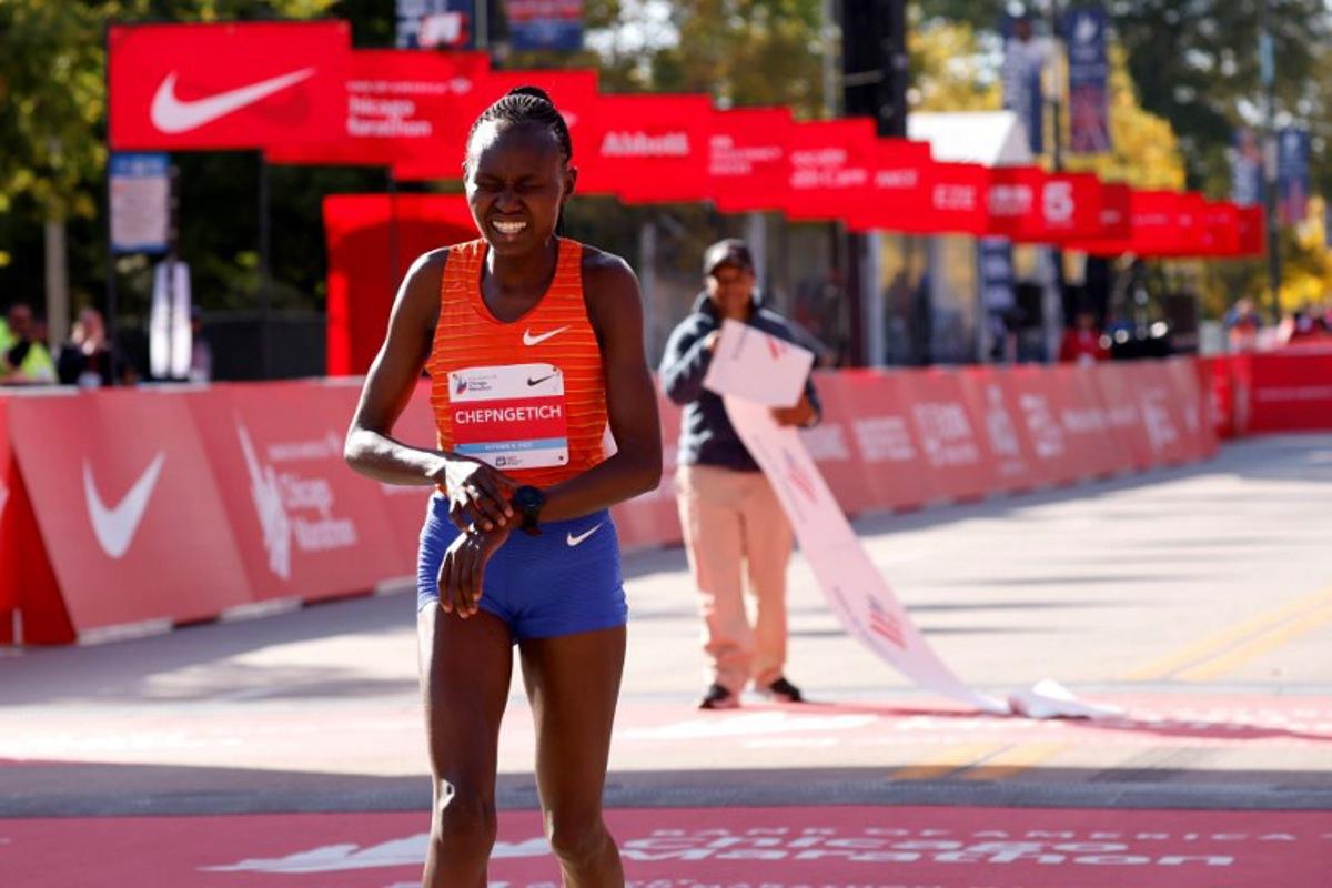 Kenya's Ruth Chepngetich reacts after crossing the finish line to place first in the women's division of the 2022 Bank of America Chicago Marathon in Chicago, Illinois, on October 9, 2022.  KAMIL KRZACZYNSKI / AFP