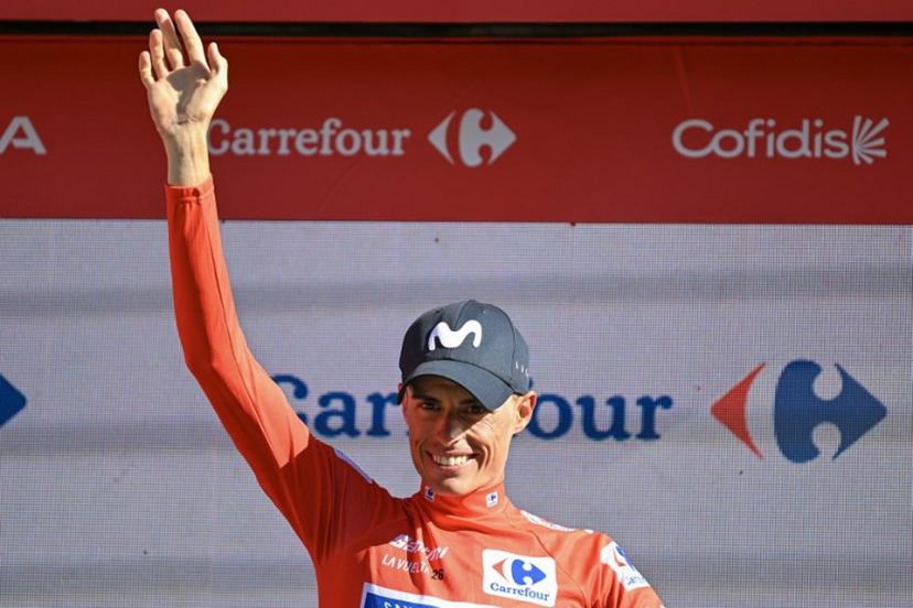 Team Movistar's Spanish rider Enric Mas celebrates reatining the overall race lead on the podium after the 18th stage of the Vuelta a Espana 2026 cycling tour, a 32,1 km individual time-trial race between El Puerto de Santa Maria and Jerez de la Frontera, on September 10, 2026.   JORGE GUERRERO / AFP