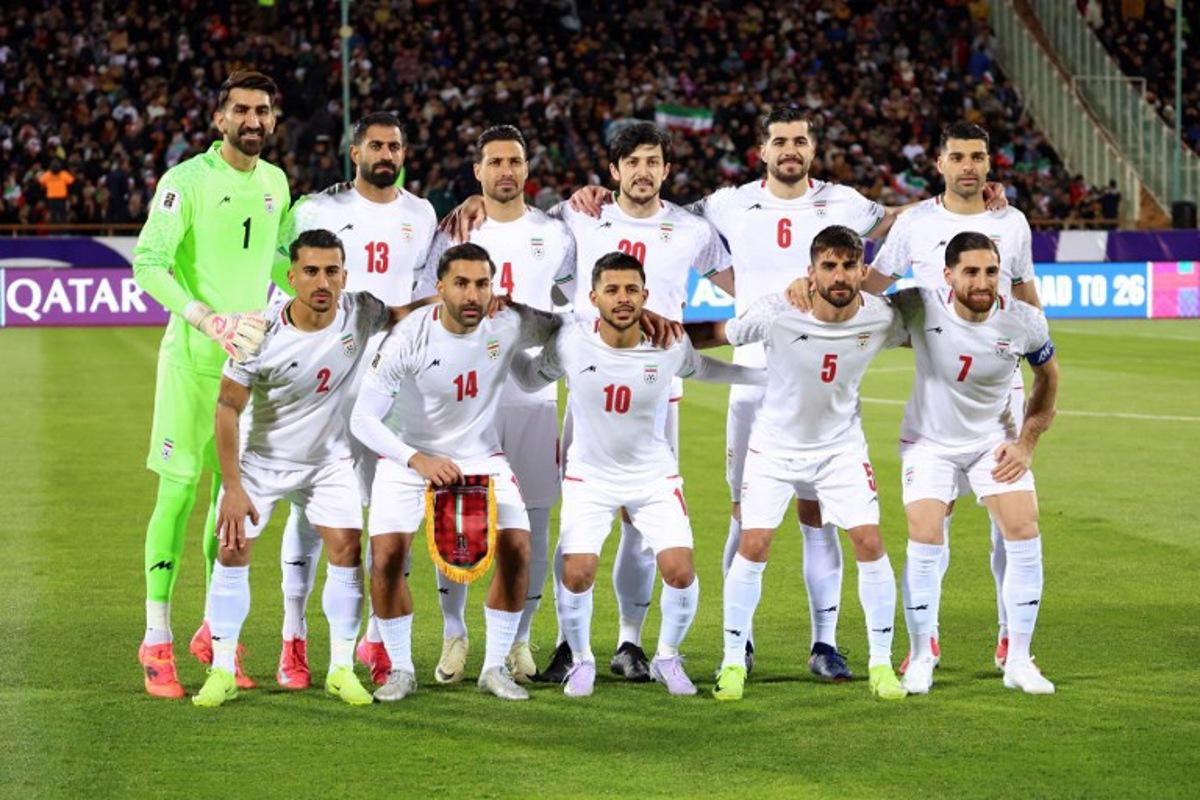 Iran's national footbal team pose for a group picture before the FIFA World Cup 2026 Asia zone qualifiers group A football match between Iran and Uzbekistan, on March 25, 2025 in Tehran.  AFP
