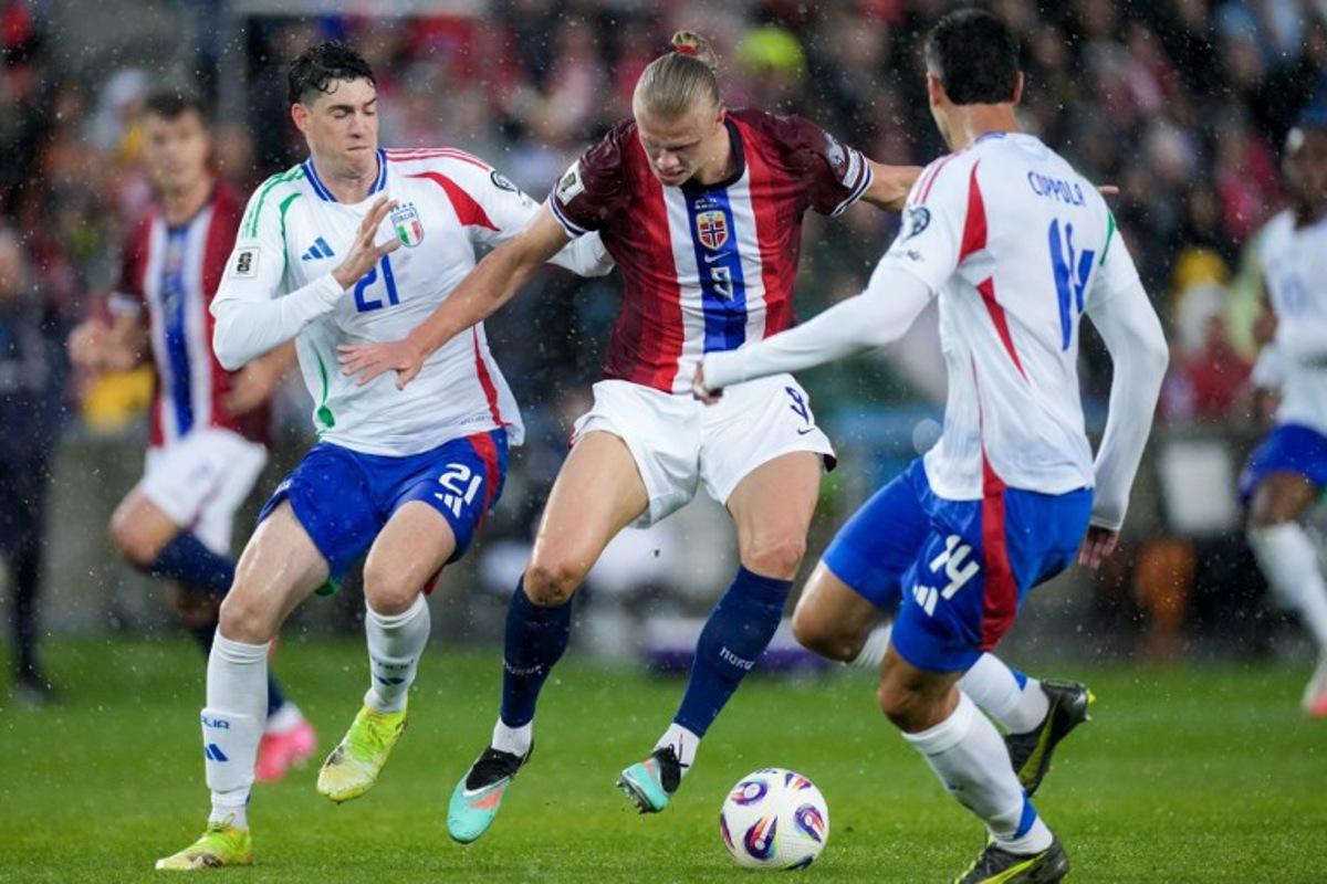 Italy's defender #21 Alessandro Bastoni (L), Norway's forward #09 Erling Braut Haaland and Italy's defender #14 Diego Coppola vie for the ball during the 2026 FIFA World Cup Qualifying Group I football match between Norway and Italy at the Ullevaal Stadium in Oslo on June 6, 2025.  Cornelius Poppe / NTB / AFP