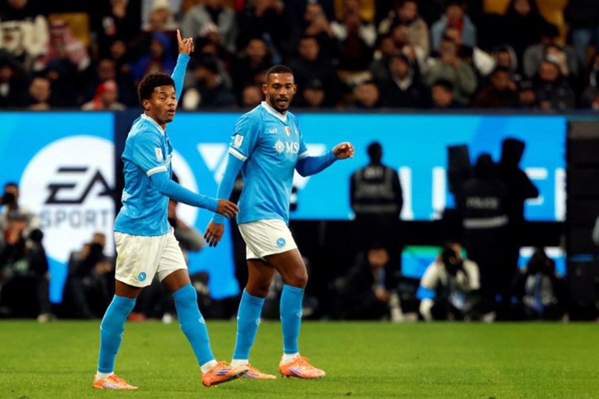 SCC Napoli's #7 David Neres (L) celebrates his goal during the Italian Super Cup semi-final match between SCC Napoli and AC Milan at King Saud University Stadium in Riyadh on December 18, 2025.  Fayez Nureldine / AFP