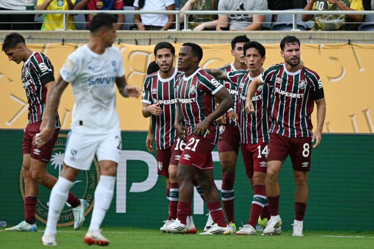 Fluminense's Brazilian midfielder #08 Martinelli celebrates with teammates after scoring his team's first goal during the FIFA Club World Cup 2025 quarterfinal football match between Brazil's Fluminense and Saudi Arabia's Al-Hilal at the Camping World Stadium in Orlando on July 4, 2025.  CHANDAN KHANNA / AFP