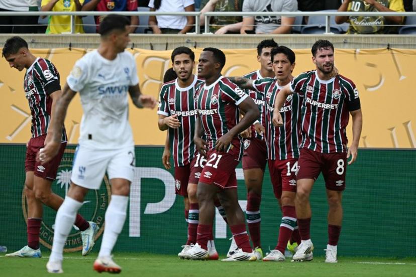 Fluminense's Brazilian midfielder #08 Martinelli celebrates with teammates after scoring his team's first goal during the FIFA Club World Cup 2025 quarterfinal football match between Brazil's Fluminense and Saudi Arabia's Al-Hilal at the Camping World Stadium in Orlando on July 4, 2025.  CHANDAN KHANNA / AFP