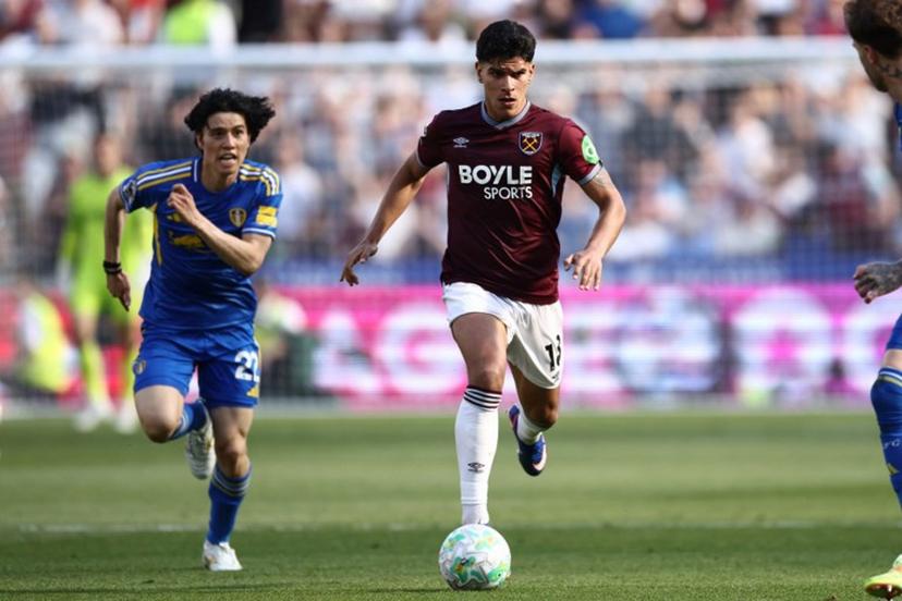 West Ham United's Portuguese midfielder #18 Mateus Fernandes runs with the ball during the English Premier League football match between West Ham United and Leeds United at the London Stadium, in east London on May 24, 2026.  Henry NICHOLLS / AFP