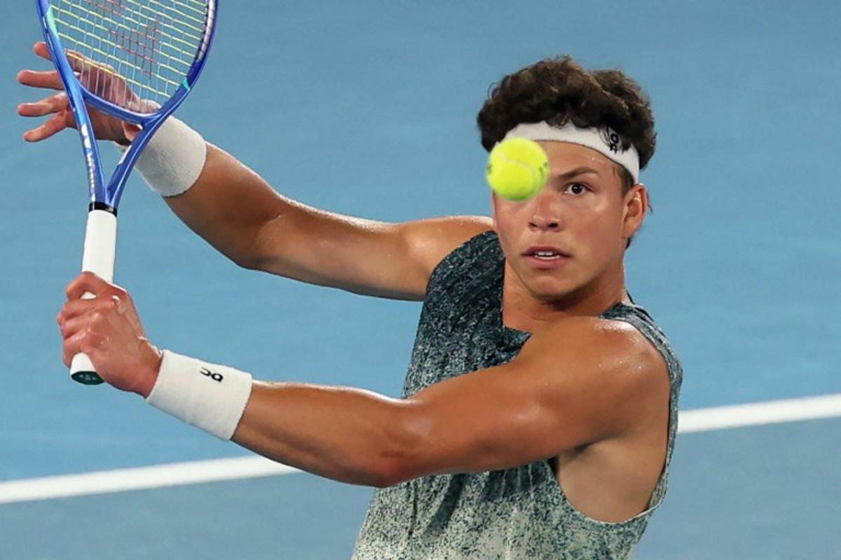 USA's Ben Shelton hits a shot against Norway's Casper Ruud during their men's singles match on day nine of the Australian Open tennis tournament in Melbourne on January 26, 2026.  Martin KEEP / AFP