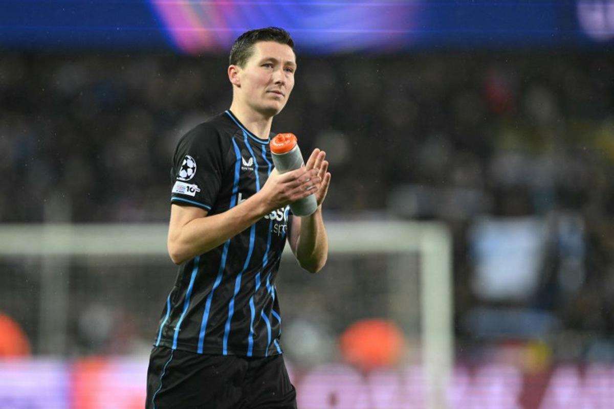 Club Brugge's Belgian midfielder #20 Hans Vanaken reacts at the end of the UEFA Champions League knockout round play-off first leg football match between Club Brugge and Atletico Madrid at the Jan Breydel Stadium in Brugge on February 18, 2026.  NICOLAS TUCAT / AFP