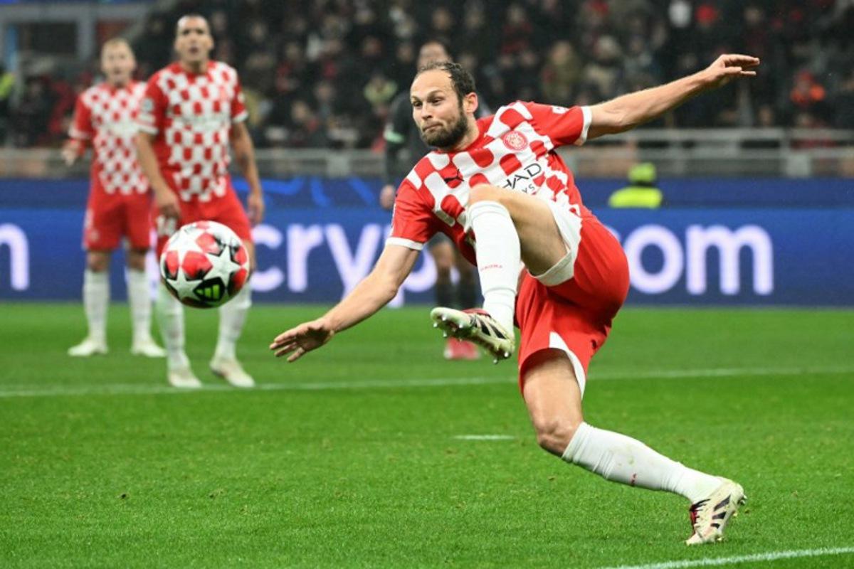 Girona's Dutch defender #17 Daley Blind kicks the ball during the UEFA Champions League football match between AC Milan and Girona at San Siro stadium in Milan, on January 22, 2025.  Alberto PIZZOLI / AFP