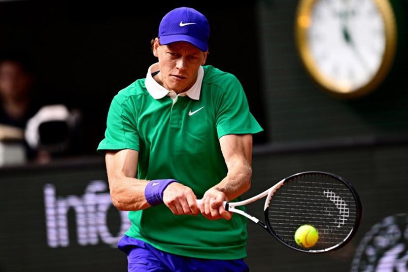 Italy's Jannik Sinner plays a backhand return to Kazakhstan's Alexander Bublik during their quarter-final men's singles match on day 11 of the French Open tennis tournament on Court Philippe-Chatrier at the Roland-Garros Complex in Paris on June 4, 2025.  JULIEN DE ROSA / AFP