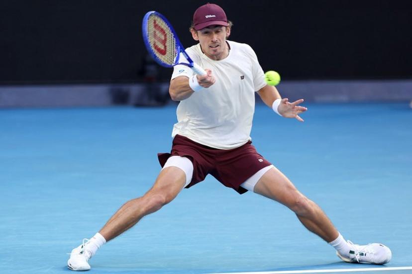 Australia's Alex De Minaur hits a return to Kazakhstan's Alexander Bublik during their men's singles match on day eight of the Australian Open tennis tournament in Melbourne on January 25, 2026.  Martin KEEP / AFP