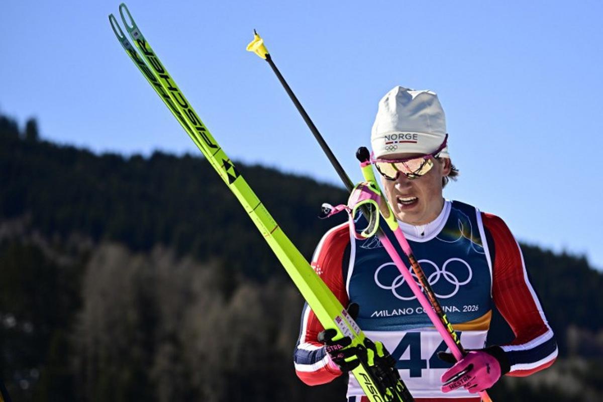 Norway's Johannes Hoesflot Klaebo reacts after crossing the finish line during the men's 10km cross-country interval start free event of the Milano Cortina 2026 Winter Olympic Games at Tesero Cross-Country Skiing Stadium in Lago di Tesero (Val di Fiemme) on February 13, 2026.  Tobias SCHWARZ / AFP